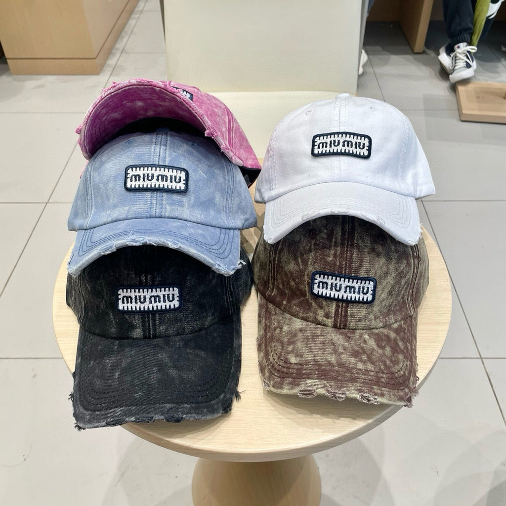 MIU MIU MM DISTRESSED FABRIC BASEBALL CAP IN WHITE WITH EMBROIDERED LOGO